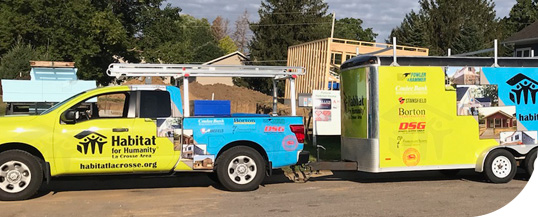 habitat truck pulling trailer