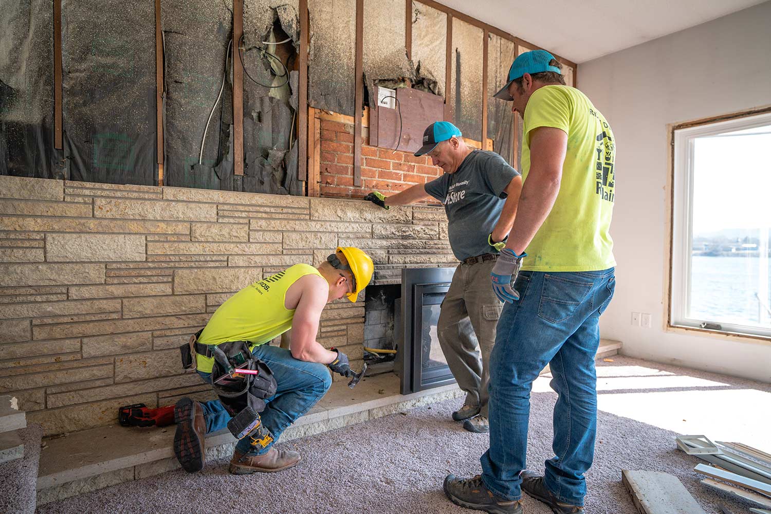 habitat team working on fireplace area