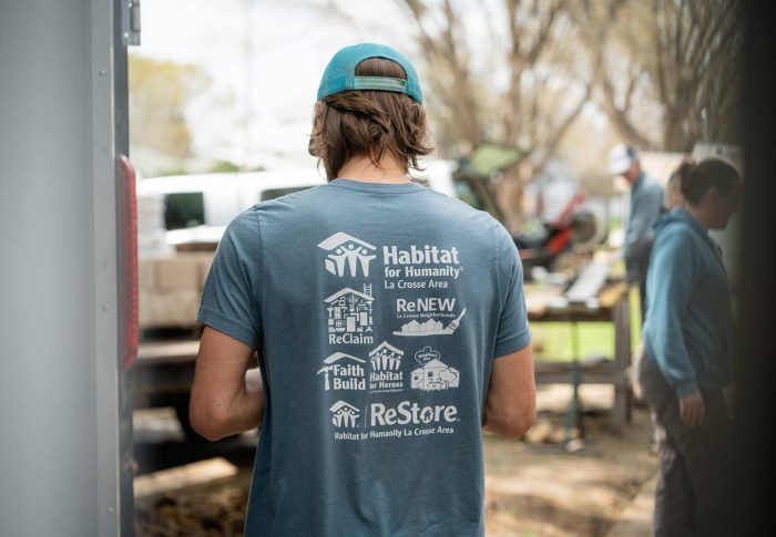 back of a volunteer looking at job site