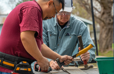 volunteers pulling nails