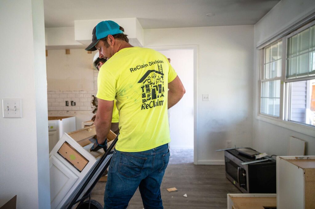 Workers installing cabinets