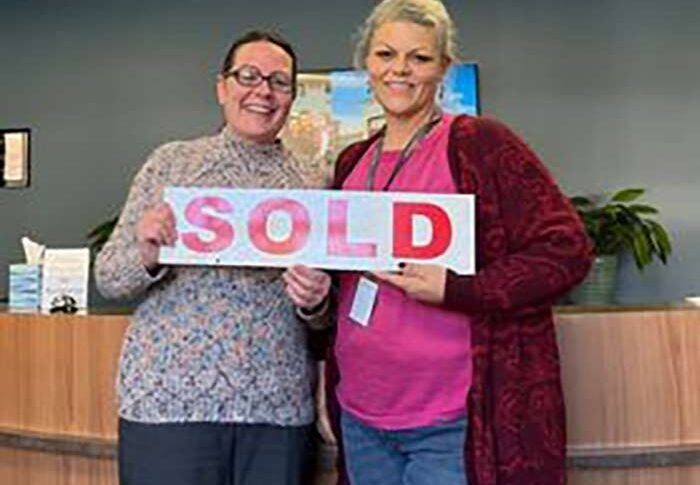 habitat owner with sold sign