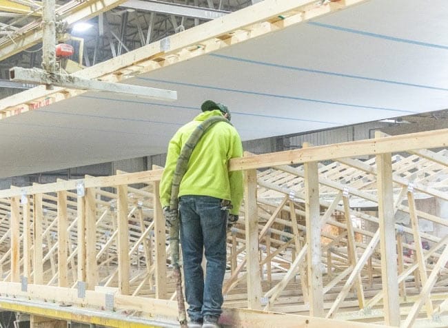 person working on trusses